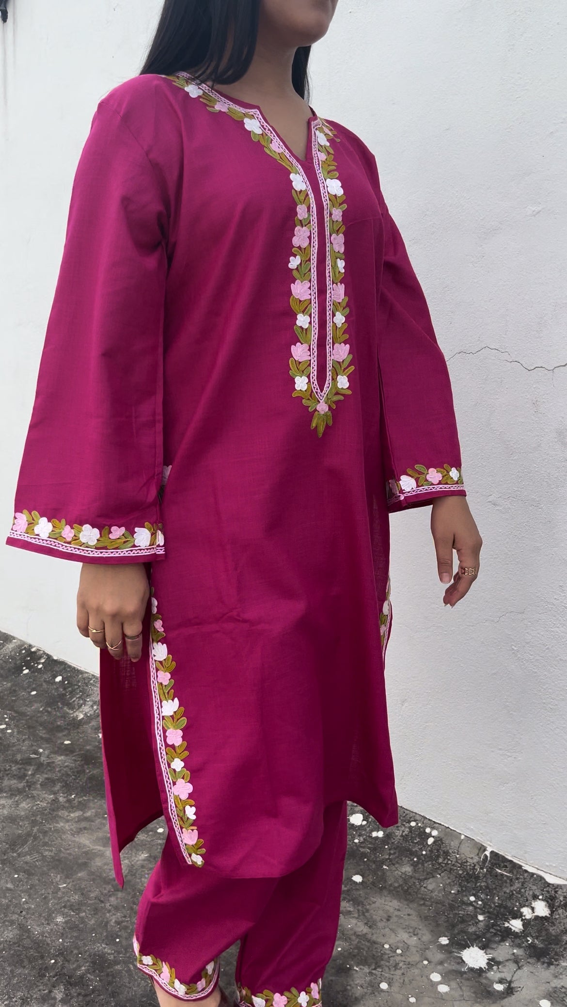 Side profile of the model in Amairah suit – elegant fit with feminine details and classic finish