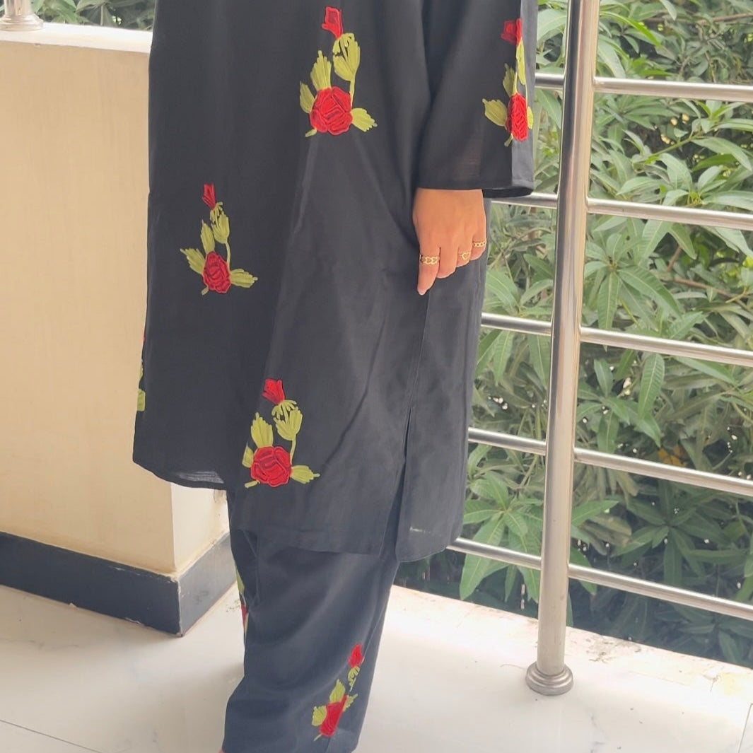Side profile of model in Gul black kurta set – contemporary cut with desi-inspired fabric texture