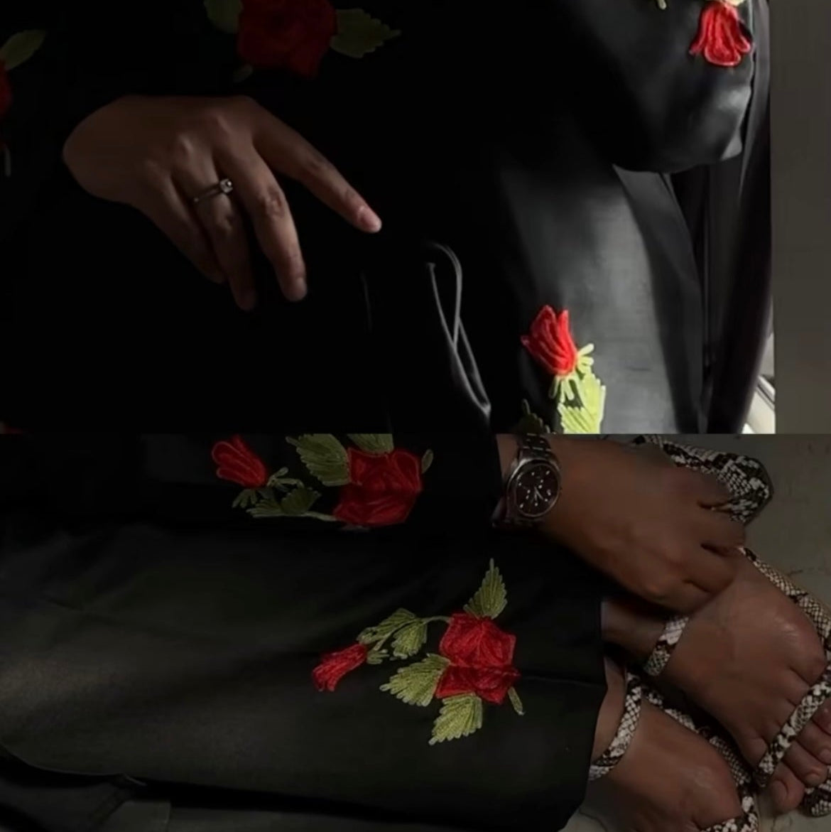 Person wearing a black outfit with floral embroidery, sitting on a chair.