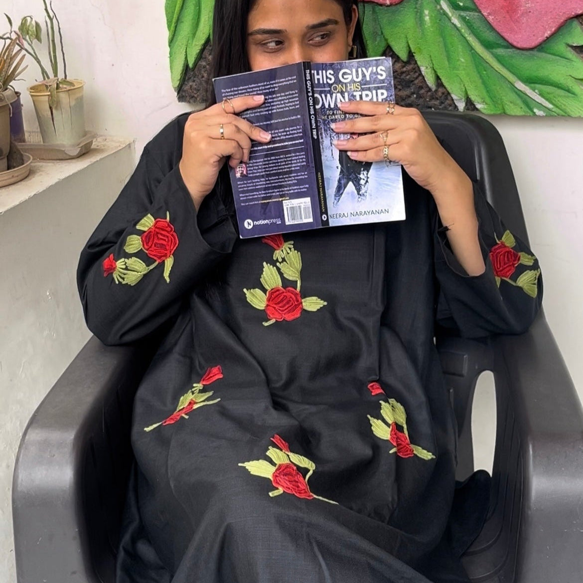 Sitting pose in Gul suit set – black self-fabric ensemble perfect for elevated everyday wear