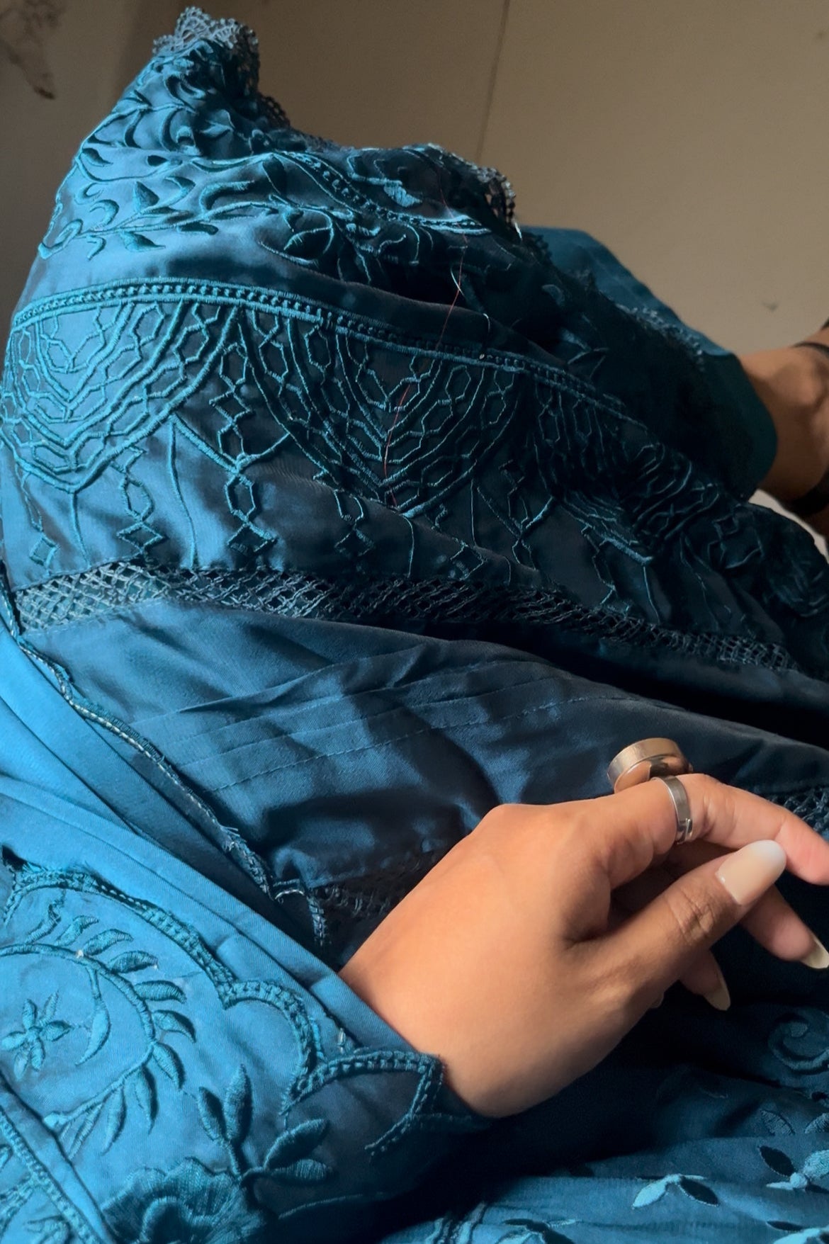 Sitting pose in Pakistani loose fit suit – tone-on-tone organza embroidery with luxe festive finish