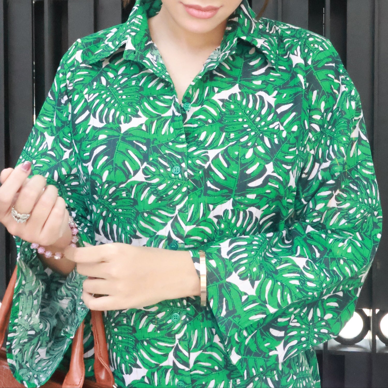 Model wearing BEGUM’S Green Tropical Summer Kurta Set — pure cotton co-ord with tropical leaf print, lace detailing on neckline and sleeves, breathable and lightweight for chic summer wear.