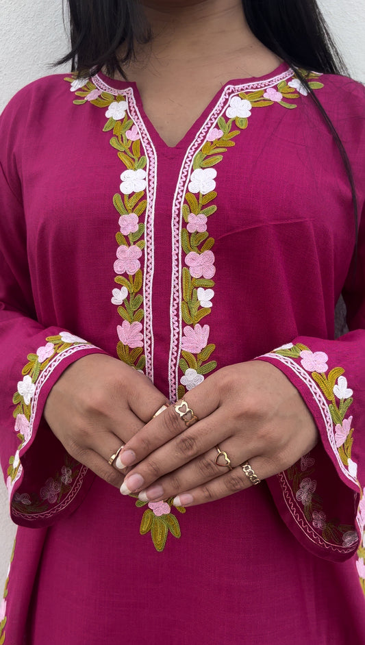 Front view of model wearing Amairah – embroidered white suit set by Begum's, featuring organza dupatta and lace details